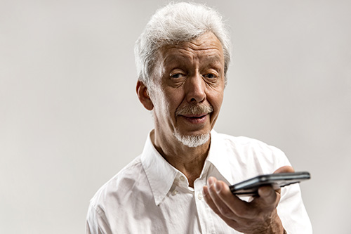 Older man using mobile phone